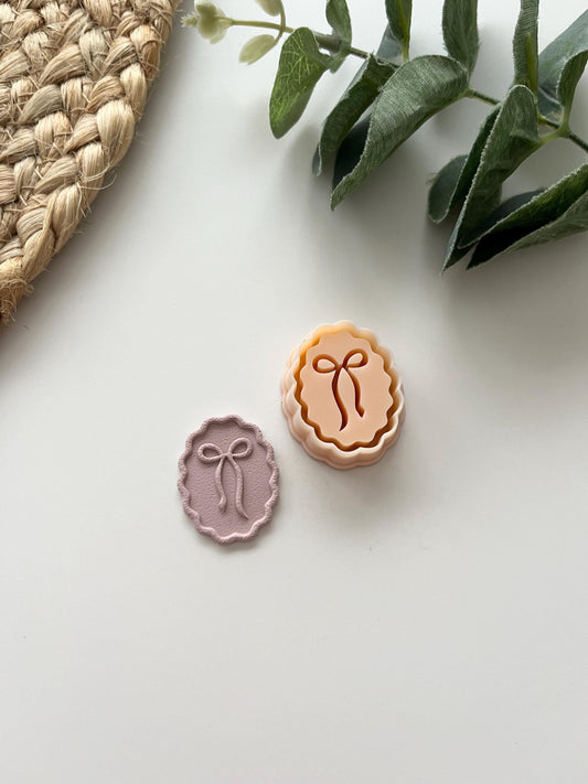 Organic Debossed Bow Oval Stamp Cutter